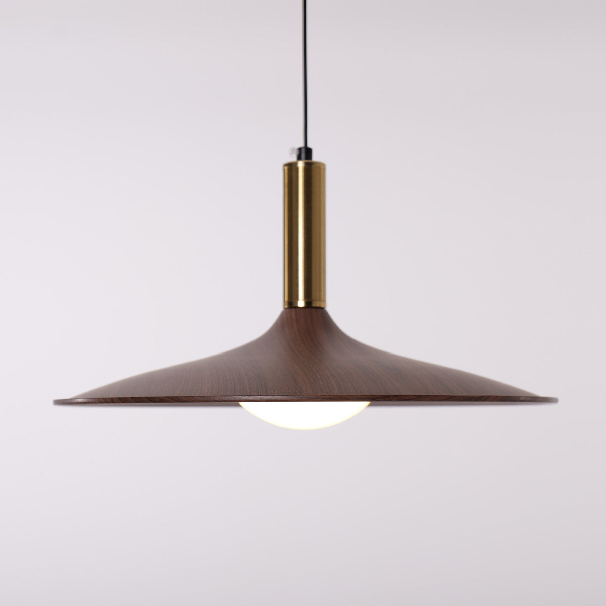 walnut double pendant light hung above a dining table