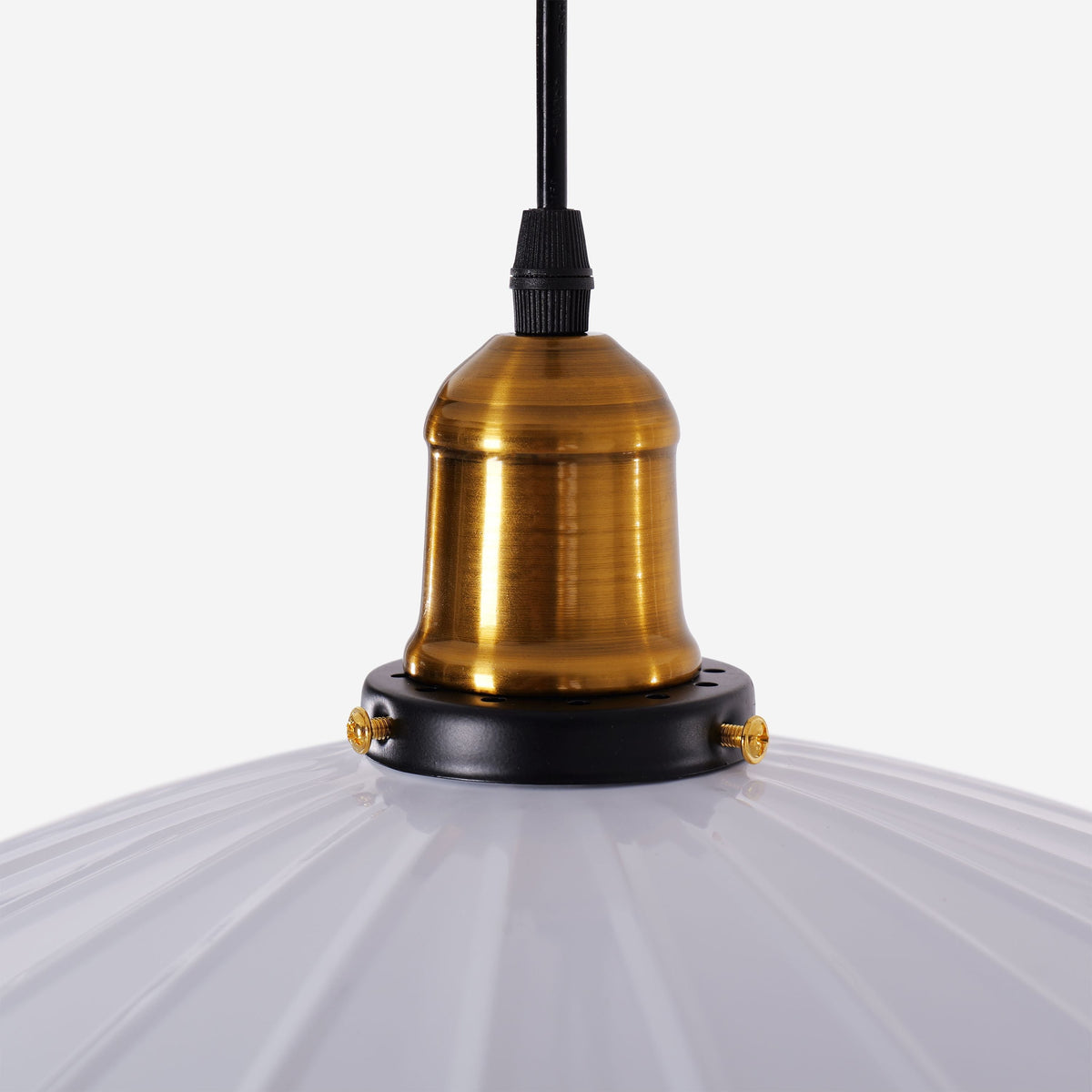 white iron pendant light beside a cosy seating area