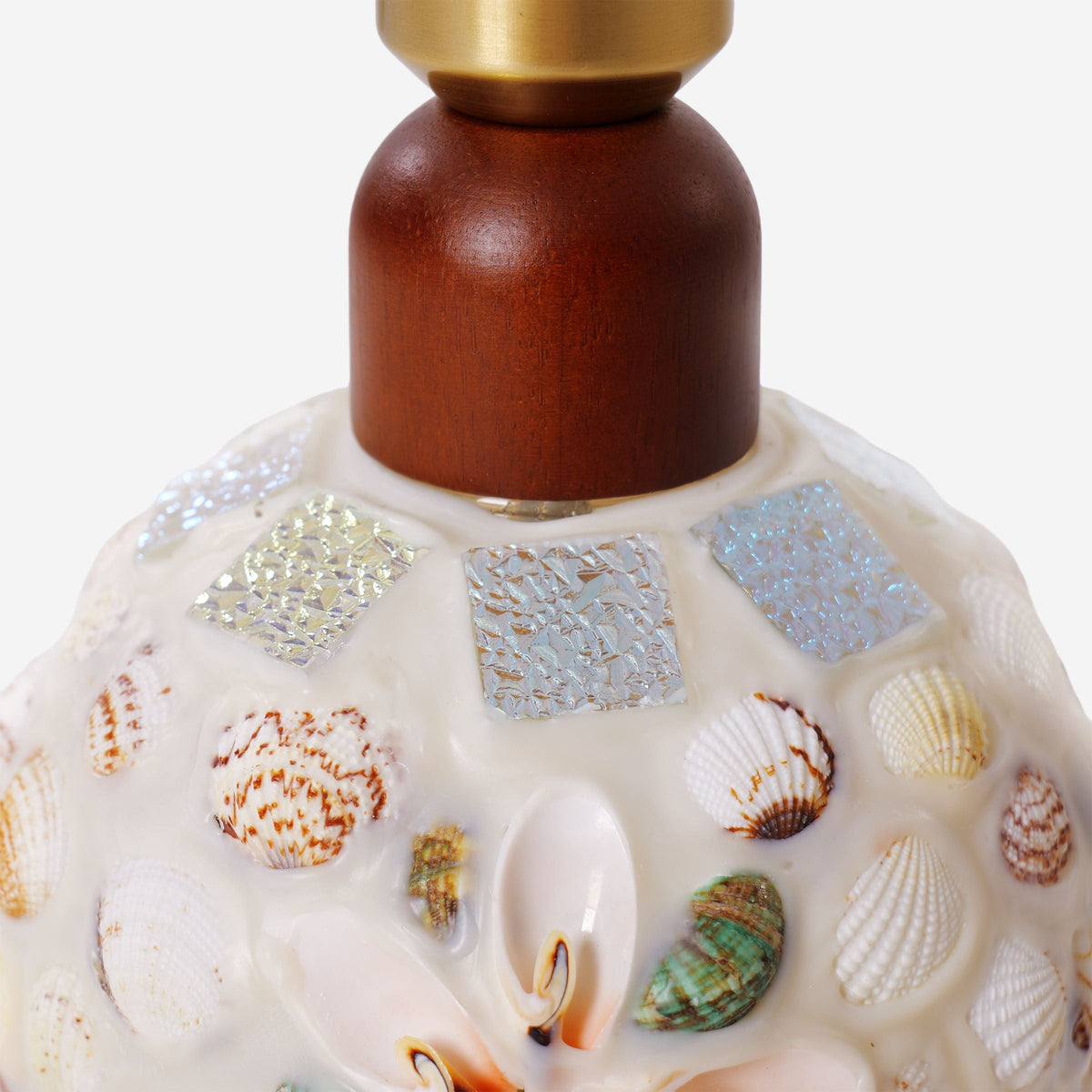 seashell mosaic table lamp styled on a small side table
