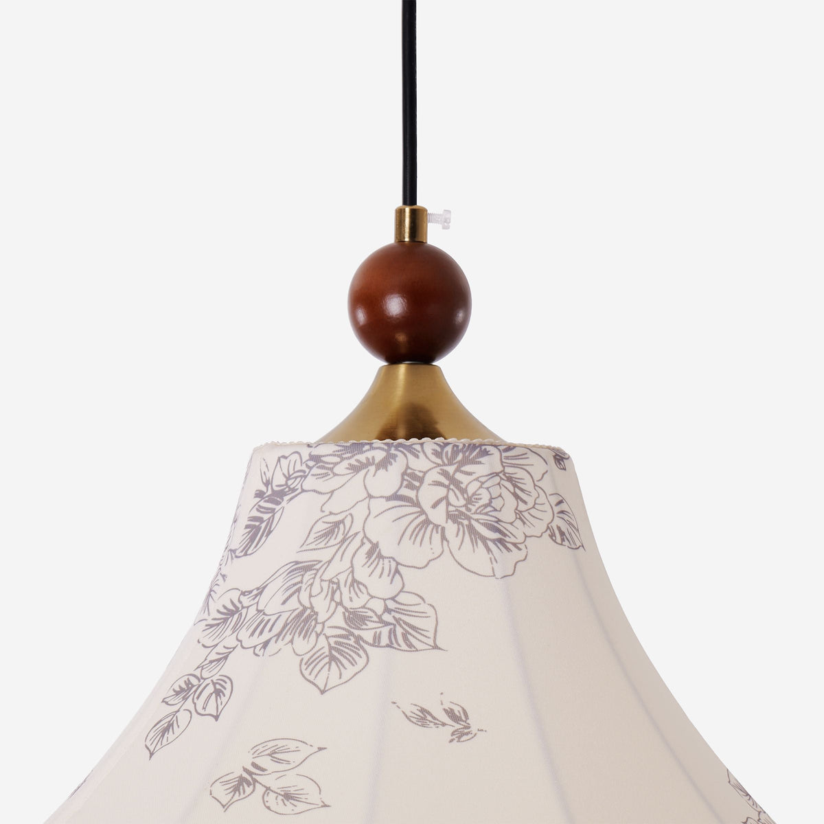 yellow floral fabric pendant light adding warm light to a dining space