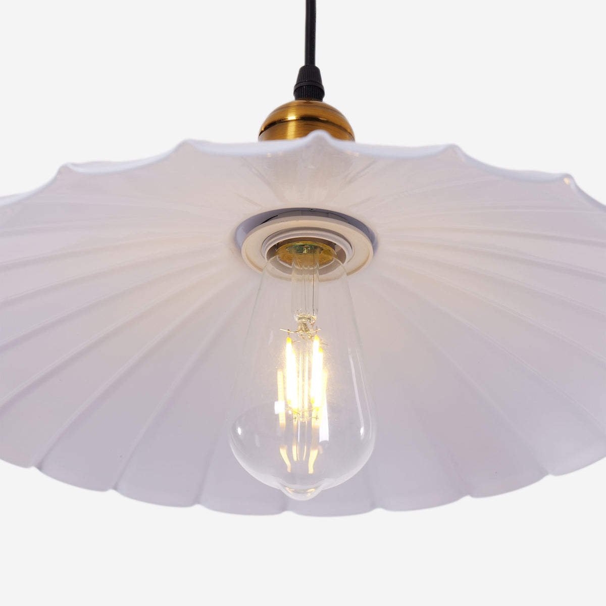 white iron pendant light styled in a calm bedroom