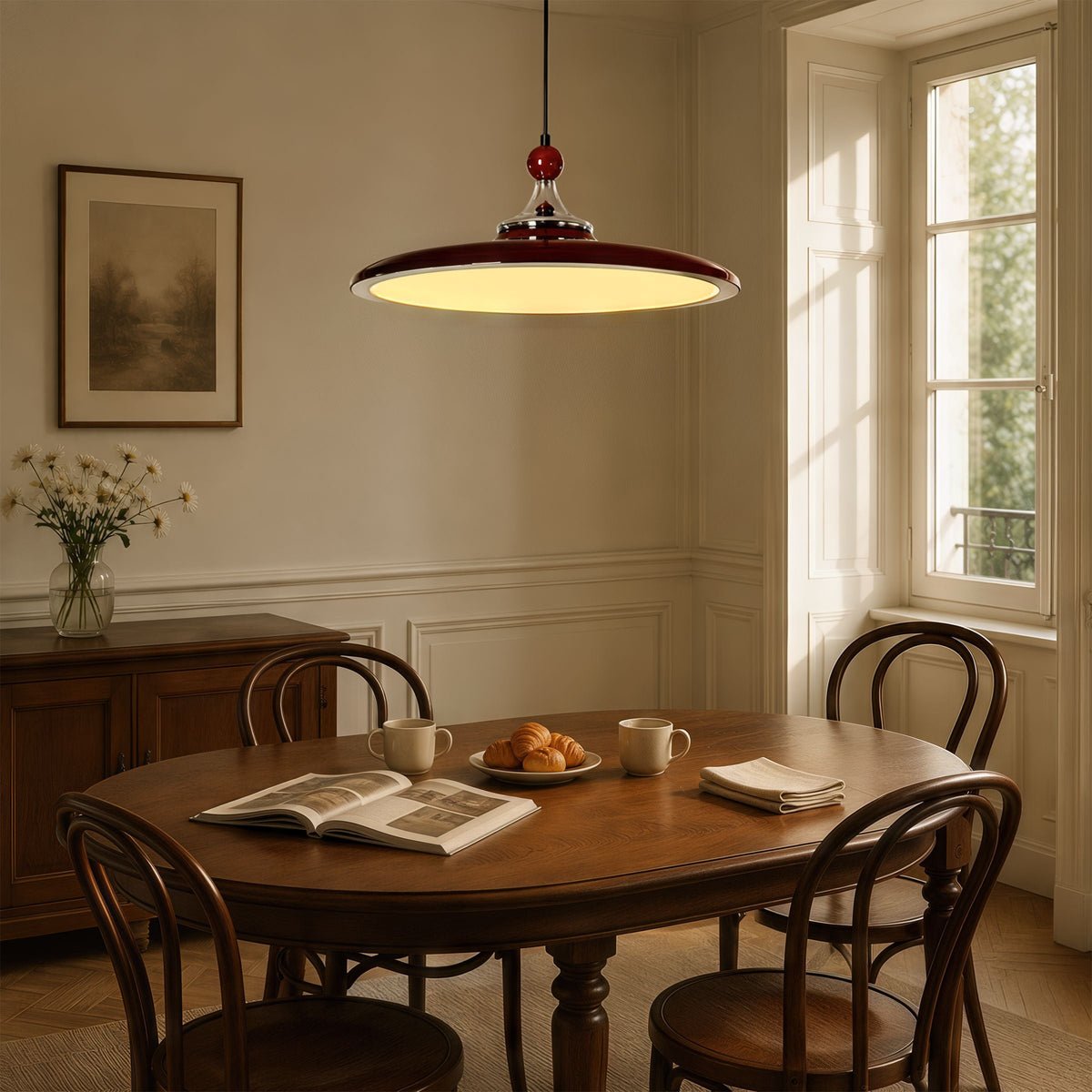 red iron pendant light over a kitchen island