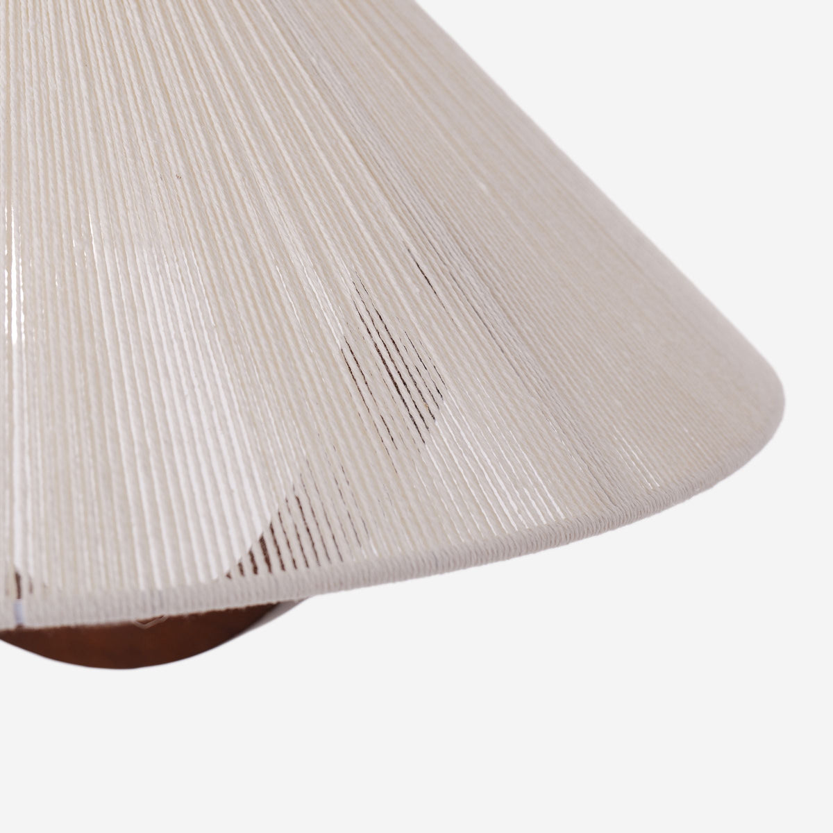natural wood curved pendant light hung above a dining table