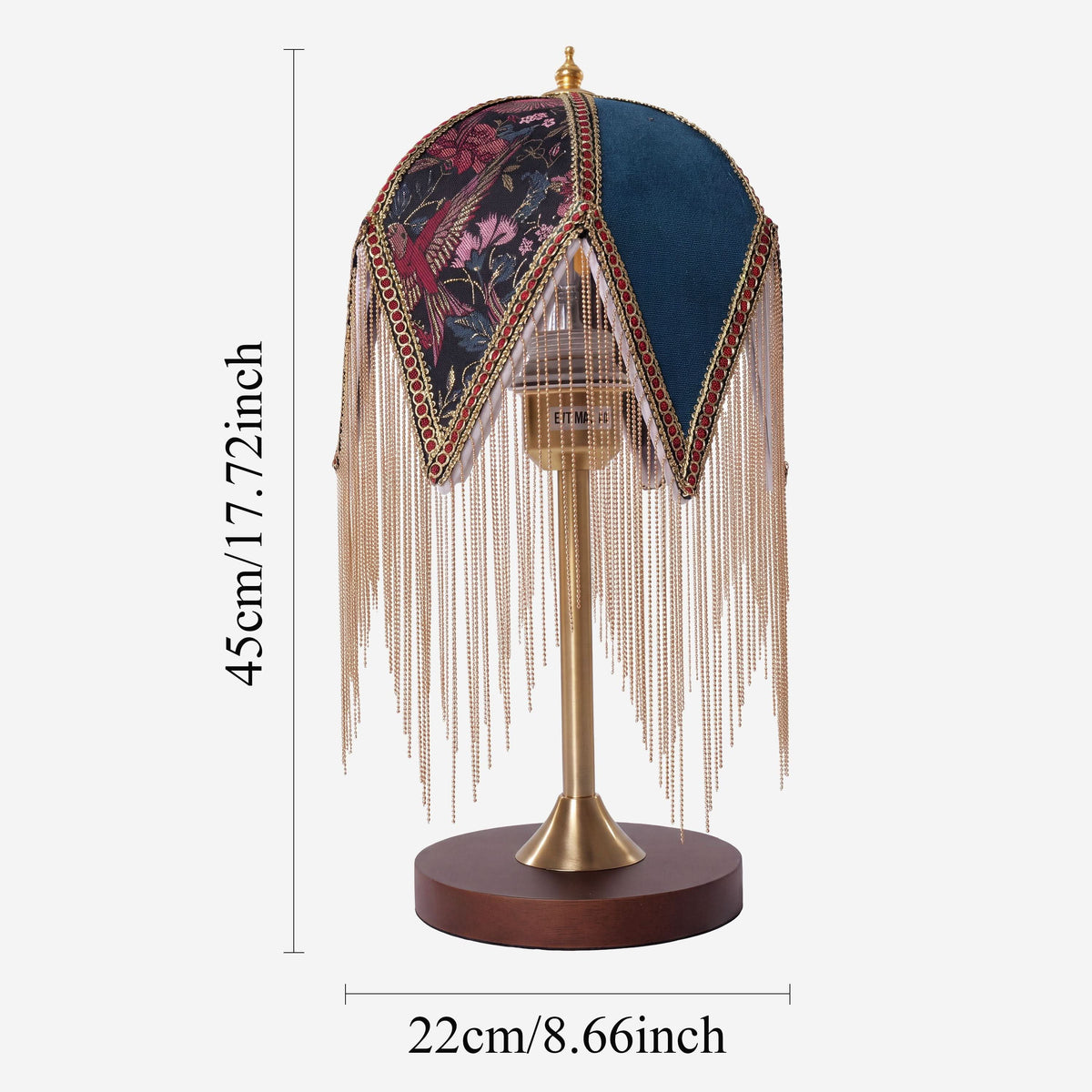 mid-century tassel table lamp adding warm light to a bedroom