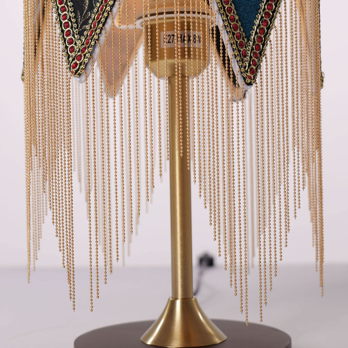 mid-century tassel table lamp with close-up shade and base details