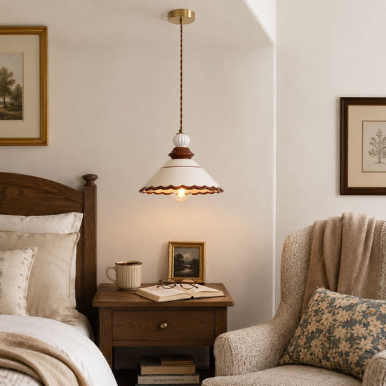brown ceramic lace pendant light hung above a dining table
