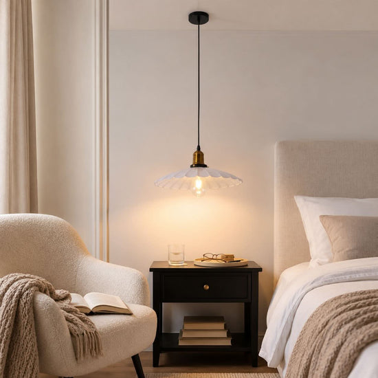 white iron pendant light beside a cosy seating area