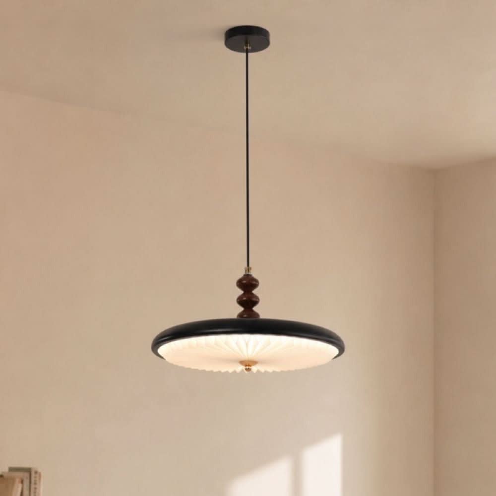 black pleated pendant light shown as a clean product view