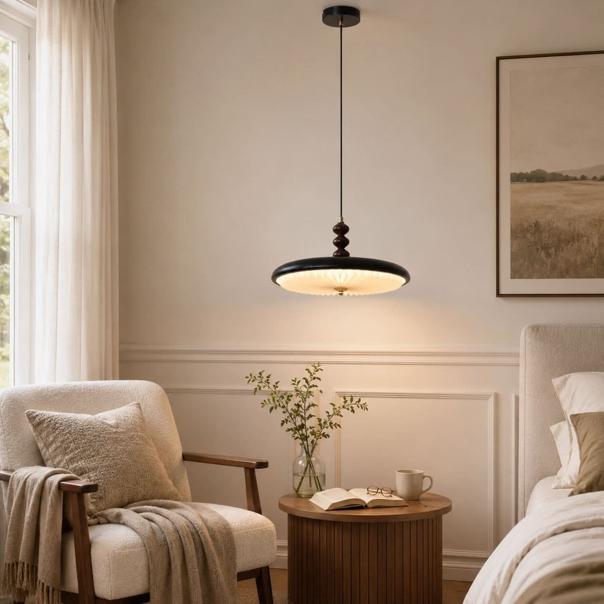 black pleated pendant light shown as a clean product view
