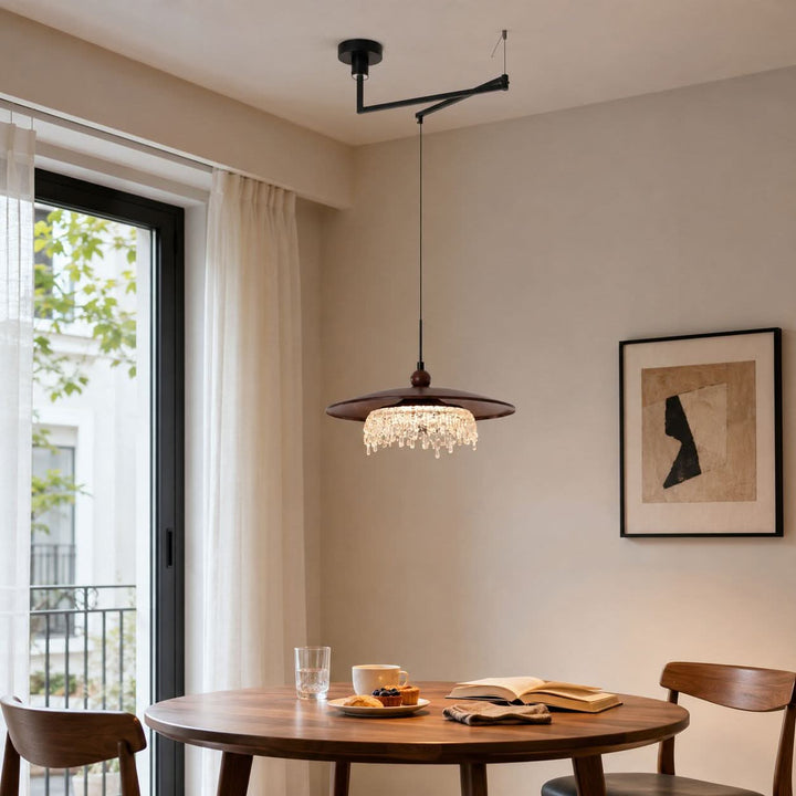 walnut folding acrylic pendant light styled in a calm bedroom
