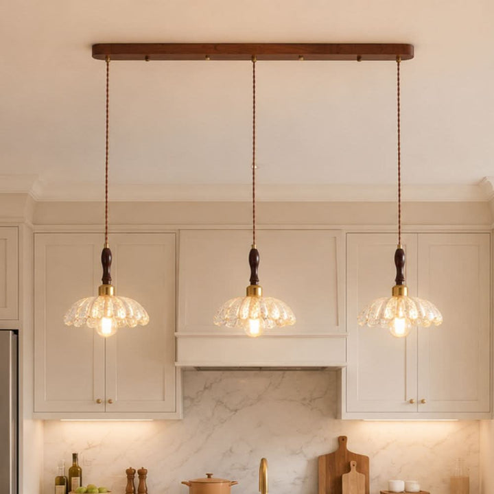 3-light walnut resin mini pendant shown as a clean product view