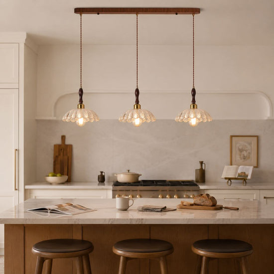 3-light walnut resin mini pendant over a kitchen island