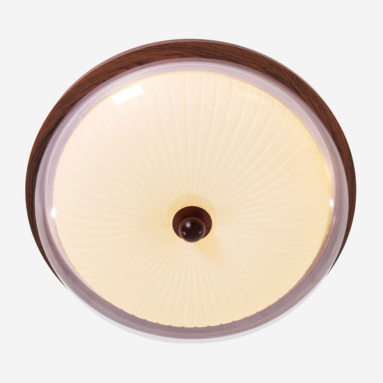 walnut ribbed acrylic ceiling light brightening a living room
