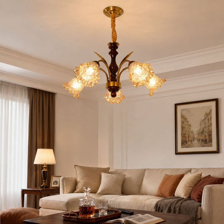 5-light copper chandelier with flower glass shades styled in a warm living room