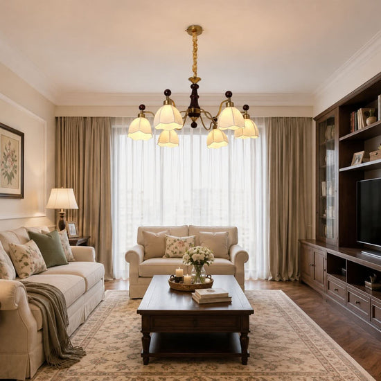 6-light chandelier with yellow fabric shades adding soft light to a bedroom