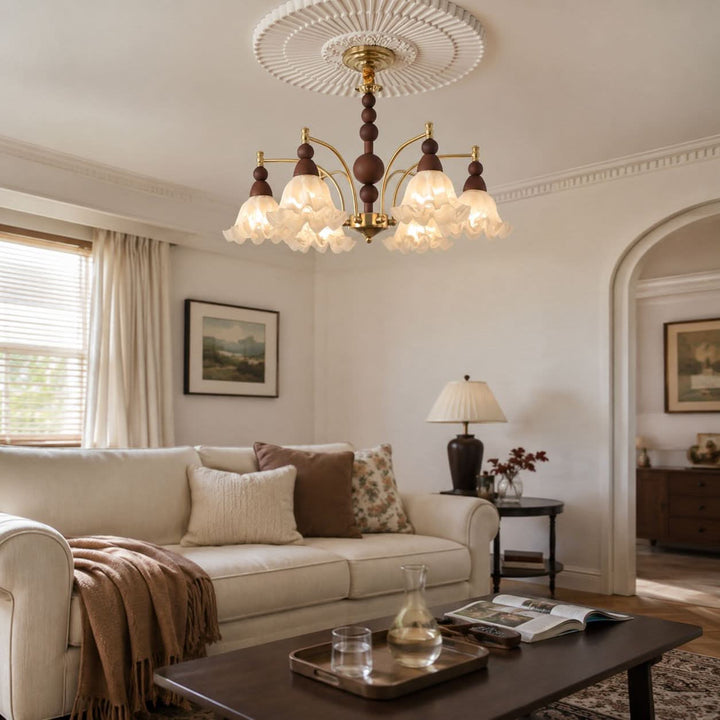 6-light chandelier with white glass shades styled in a warm living room
