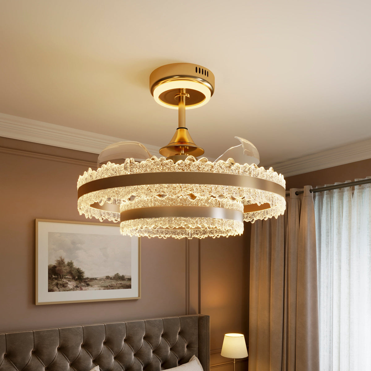 Gold crystal ceiling fan light glowing warmly above a modern bedroom