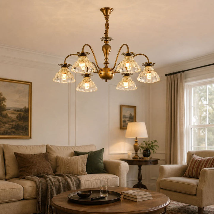 gold 6-light floral glass chandelier styled in a warm living room