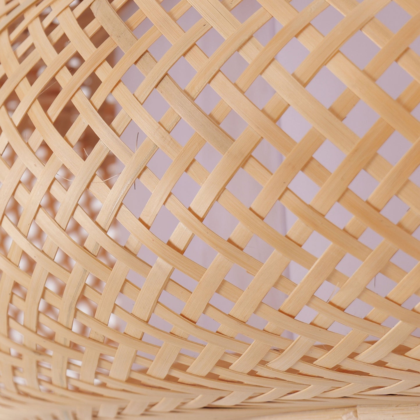 close-up of handwoven bamboo pendant shade pattern