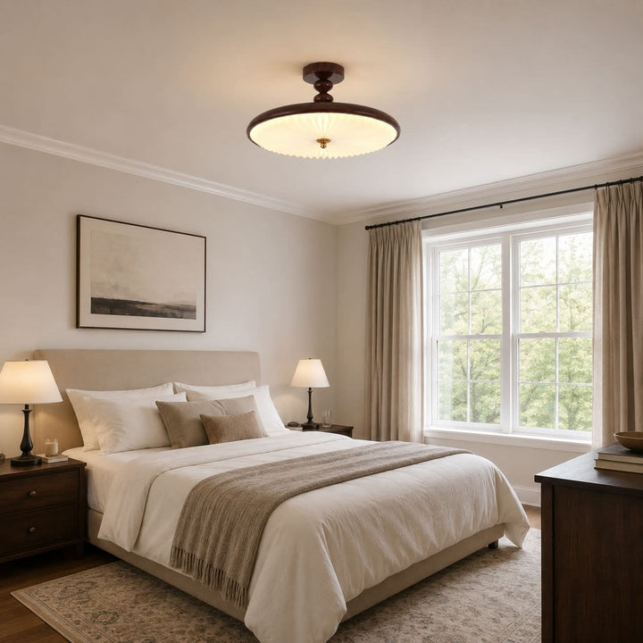 walnut pleated flush ceiling light adding warm light to a bedroom