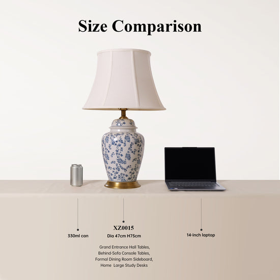blue floral ceramic table lamp size comparison beside a mug and laptop
