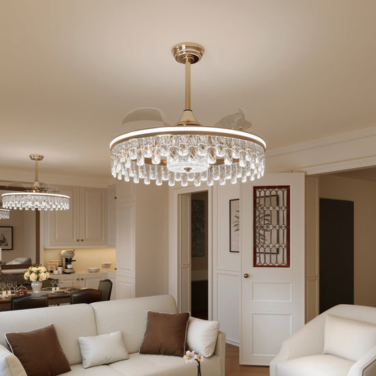 Two gold crystal ceiling fan lights installed for matching room lighting