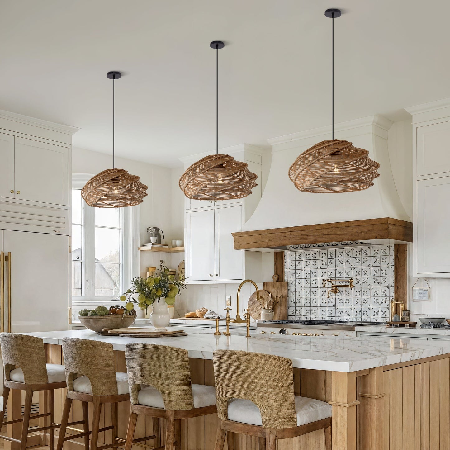 three spiral rattan pendant lights above a kitchen island with woven bar stools