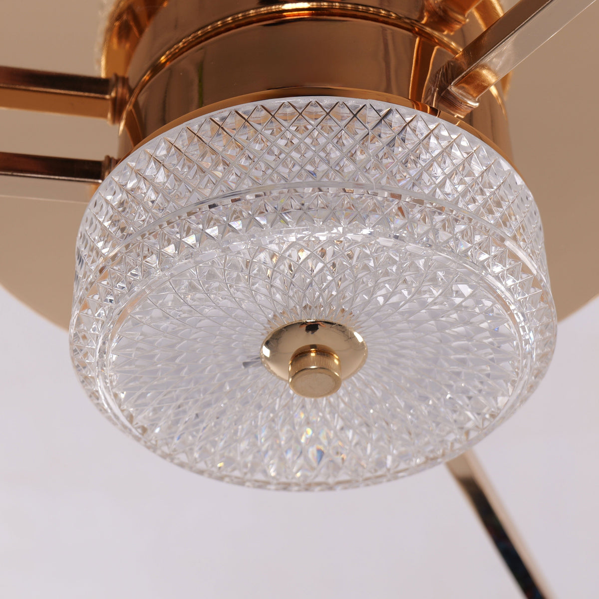 Gold ceiling fan light with crystal shade and compact flush ceiling design