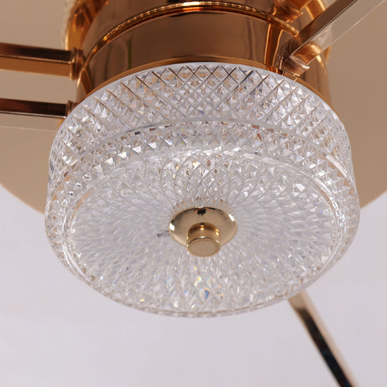 Gold ceiling fan light with crystal shade and compact flush ceiling design