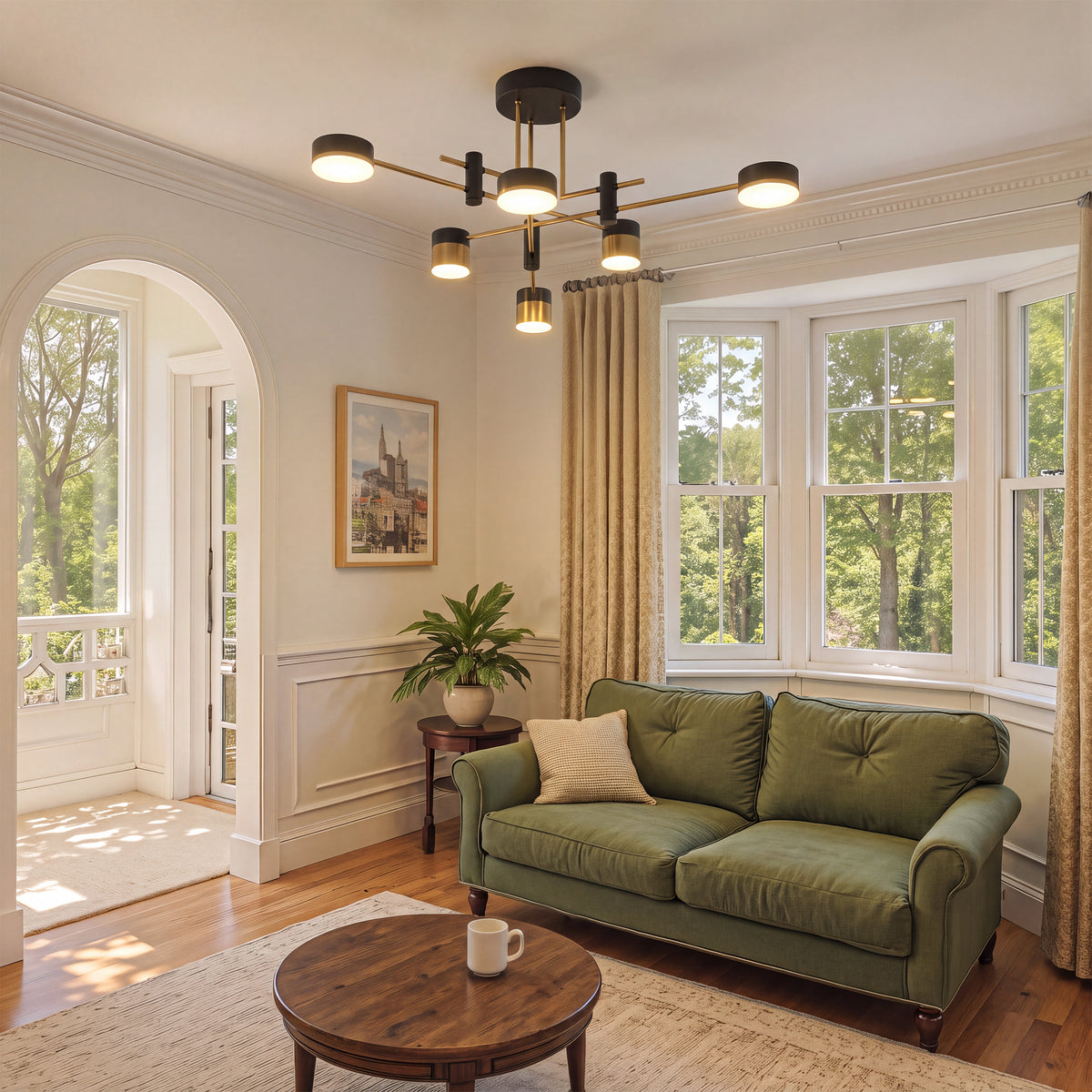 black and gold flush ceiling light adding warm light to a green sofa lounge