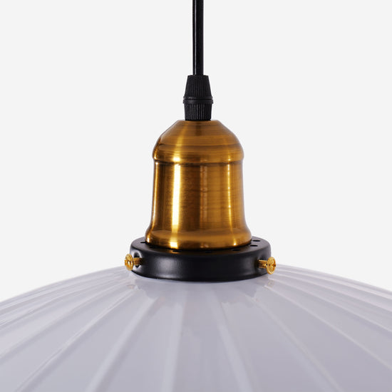 white iron pendant light beside a cosy seating area