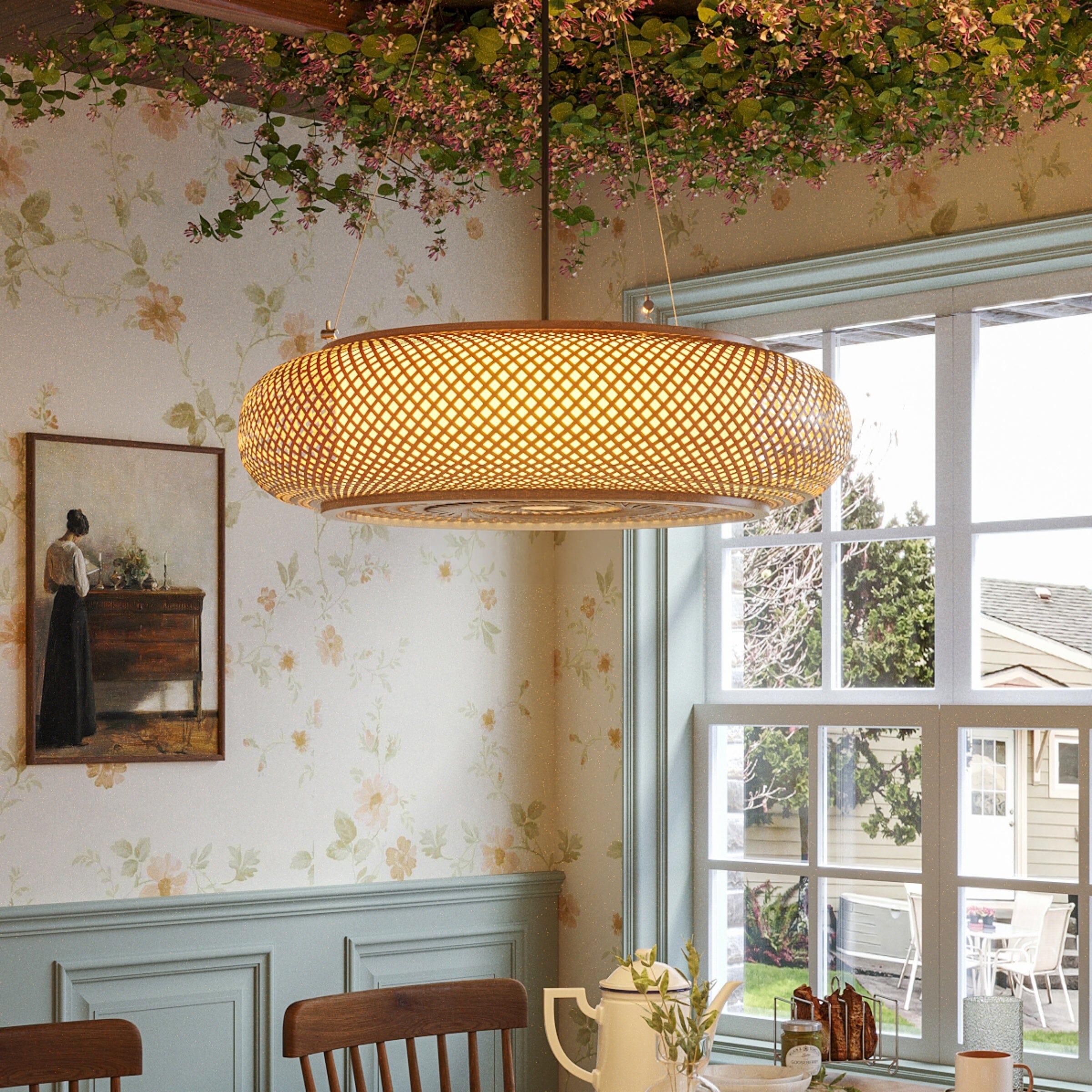 bamboo pendant light above a dining table by a window