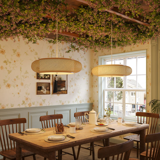 two bamboo pendant lights over a set dining table