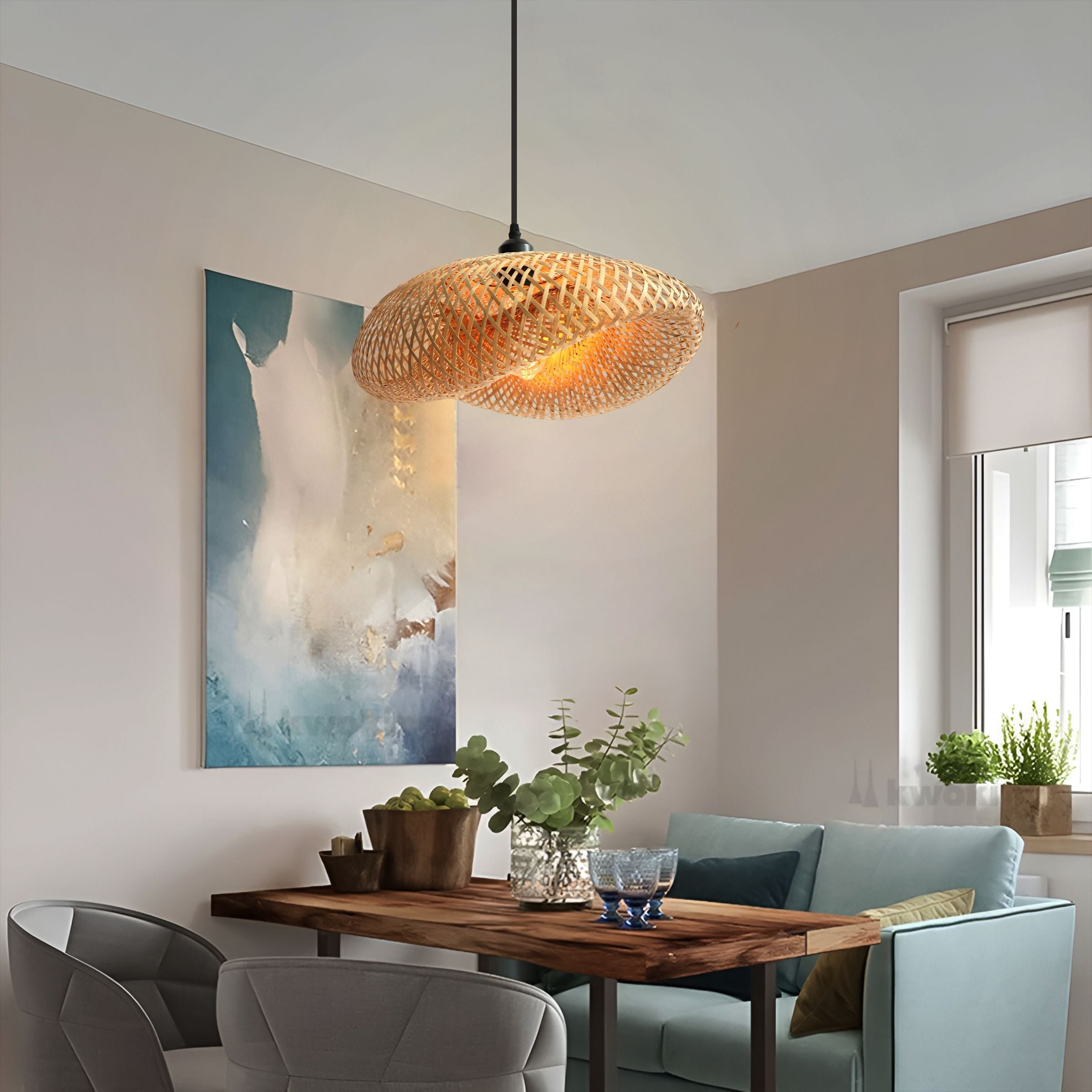 bamboo pendant light over a blue dining nook with wall art