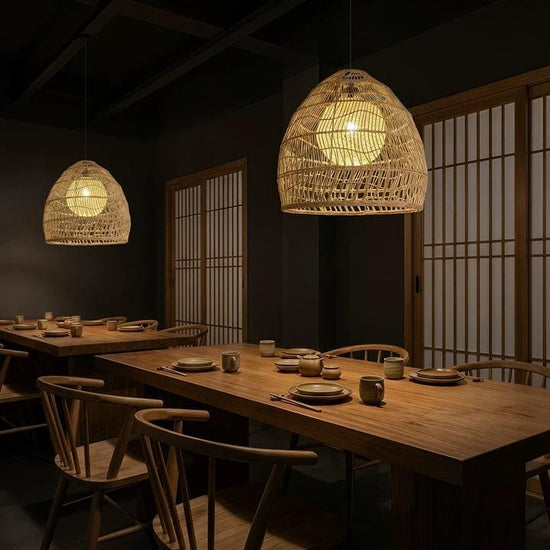 Rattan pendant lights with inner spheres above a long dining table