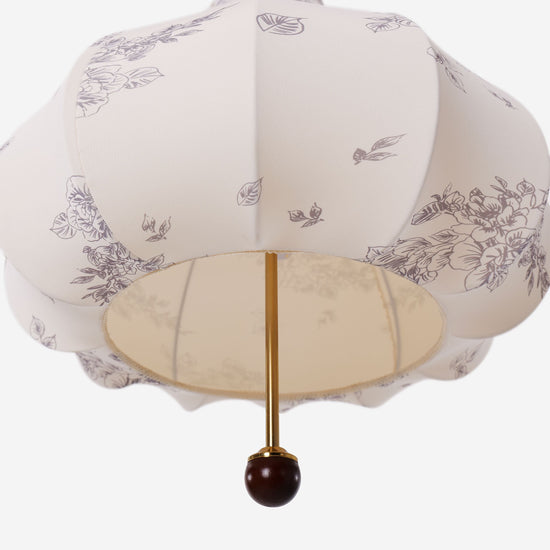 yellow floral fabric pendant light over a kitchen island