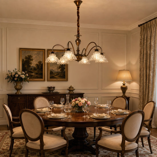 gold 6-light floral glass chandelier glowing above a dining table