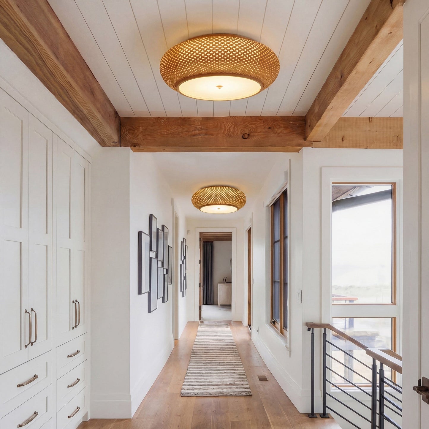 two bamboo ceiling lights along a bright hallway