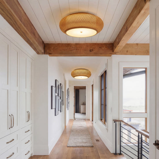 two bamboo ceiling lights along a bright hallway