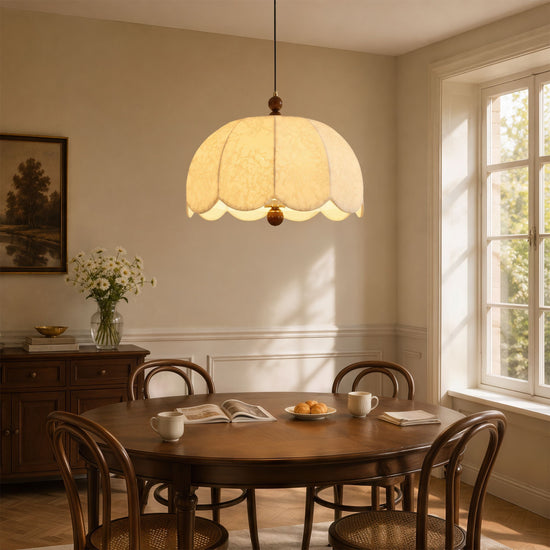 yellow fabric pendant light beside a cosy seating area