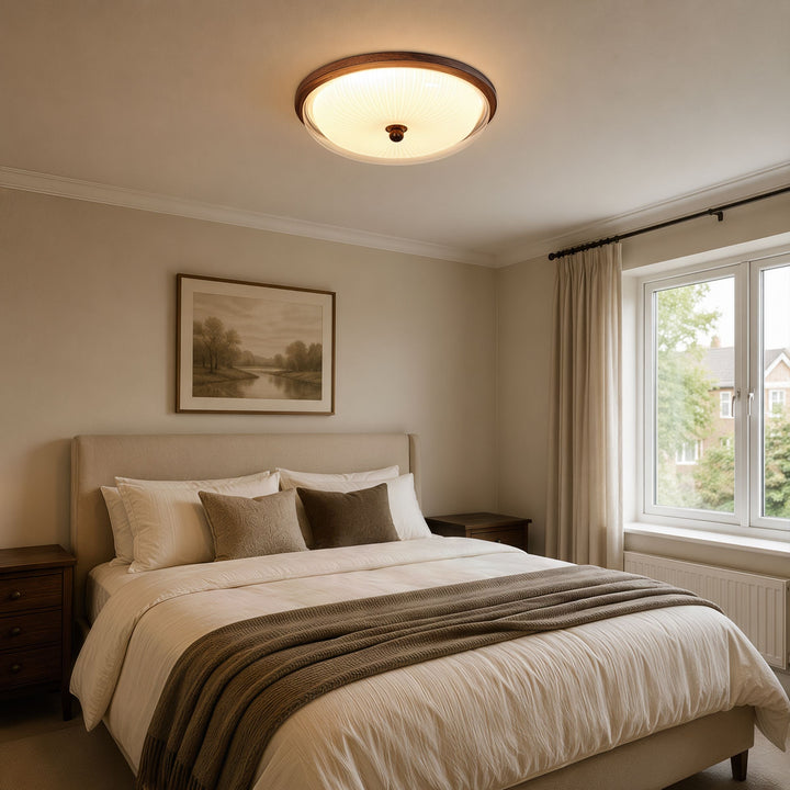 walnut ribbed acrylic ceiling light adding warm light to a bedroom