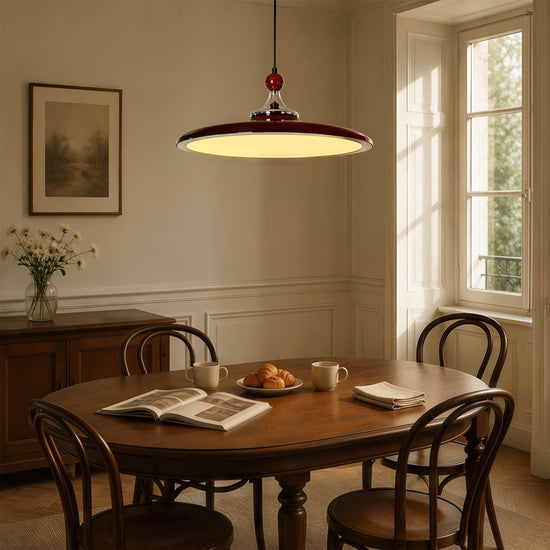 red iron pendant light over a kitchen island