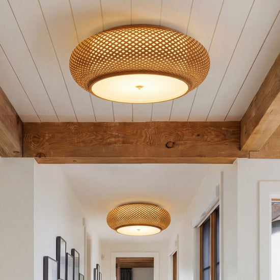 bamboo ceiling light mounted below rustic ceiling beams