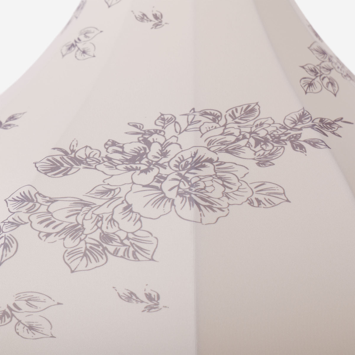 yellow floral fabric pendant light hung above a dining table
