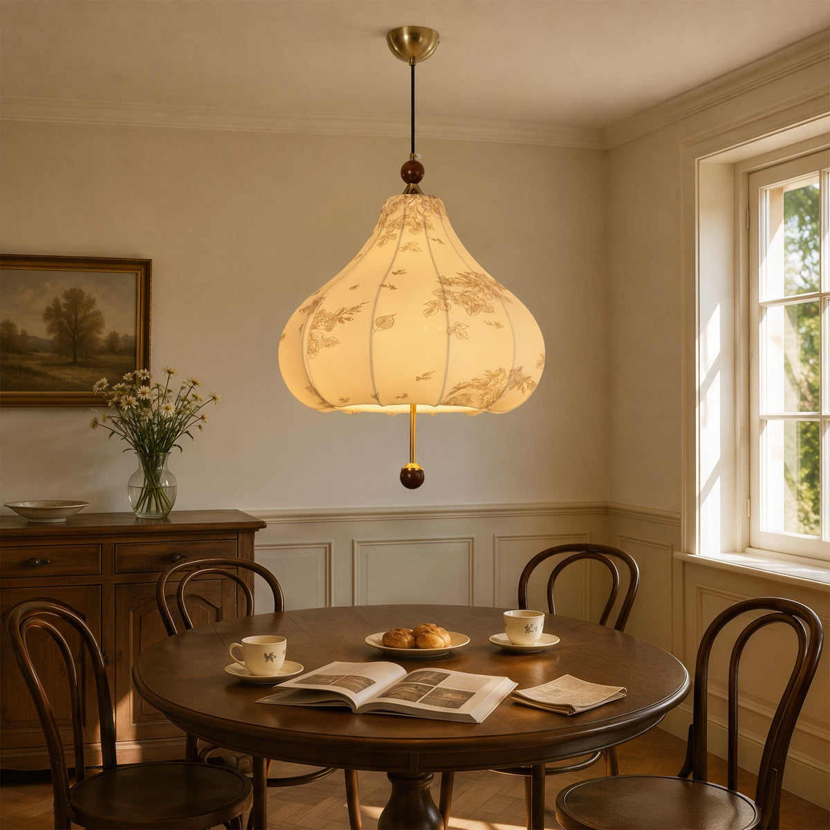 yellow floral fabric pendant light adding warm light to a dining space