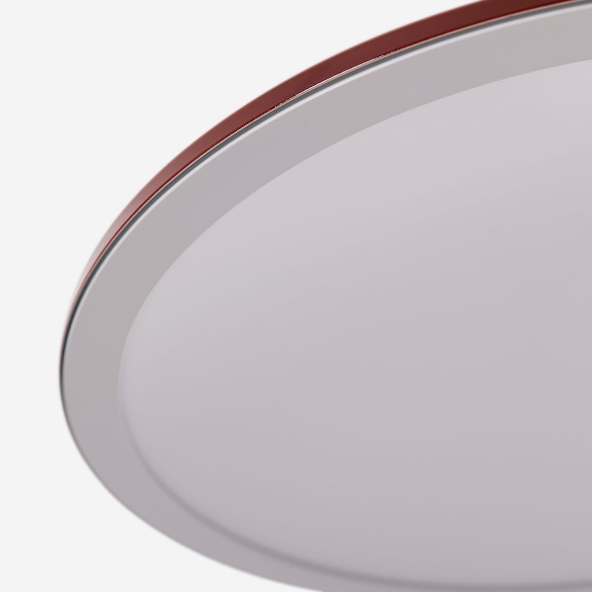 red iron pendant light styled in a calm bedroom