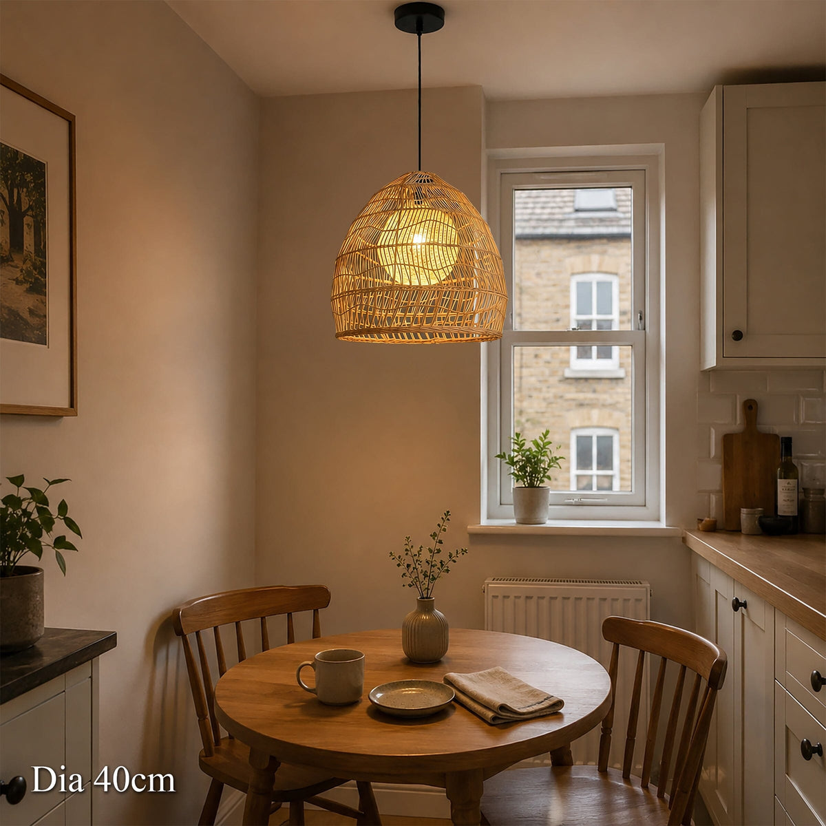 40cm rattan pendant light with inner sphere over a small round dining table