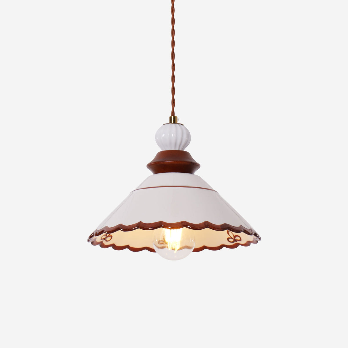 brown ceramic lace pendant light over a kitchen island