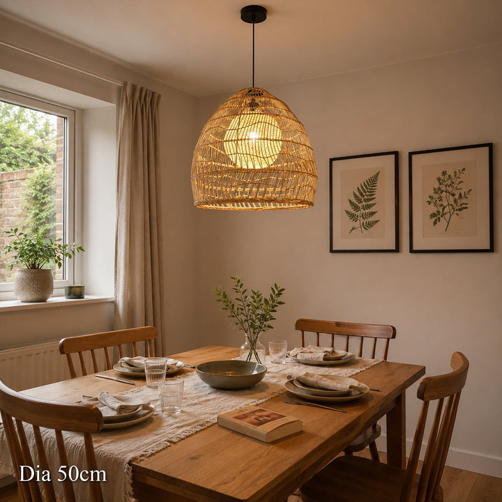 50cm rattan pendant light with inner sphere above a wooden dining table