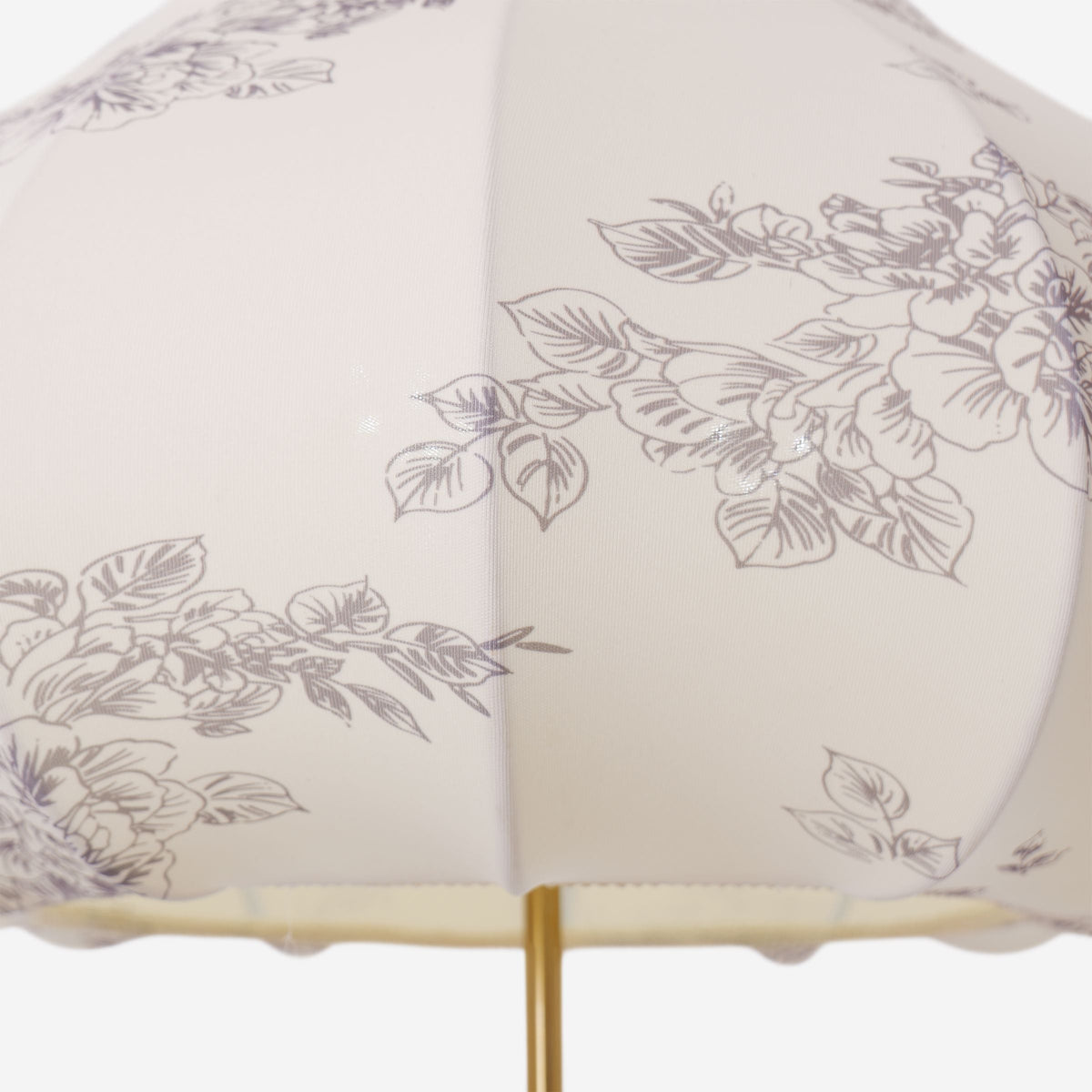 yellow floral fabric pendant light styled in a calm bedroom